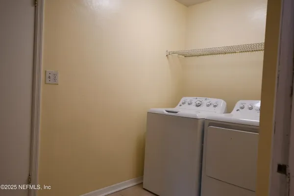 a kitchen with a refrigerator and a sink
