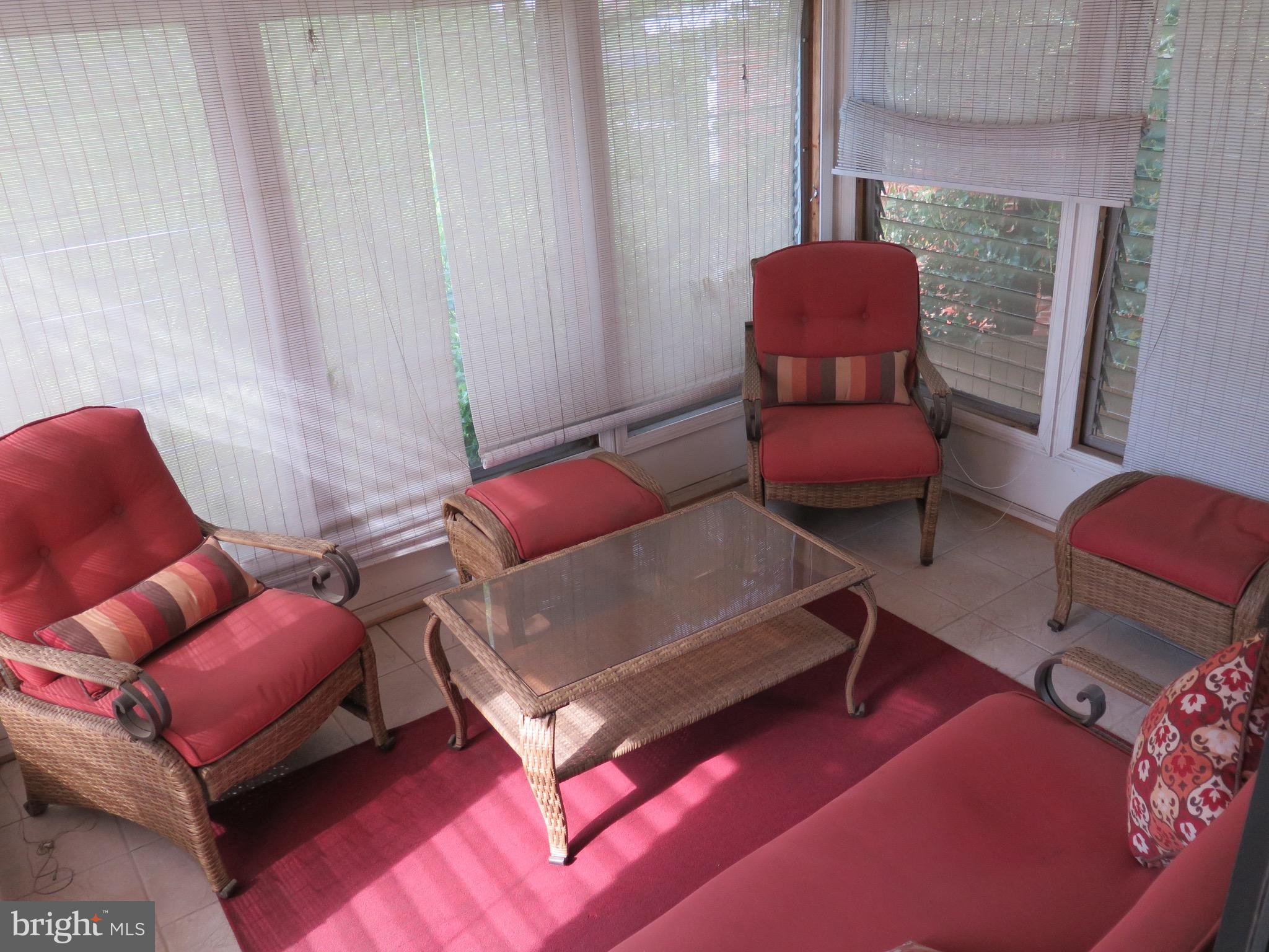 13700 Gilbert Road Woodbridge, VA 22193 - Photo 8 of 17 Spacious Sunroom overlooking the in-ground pool