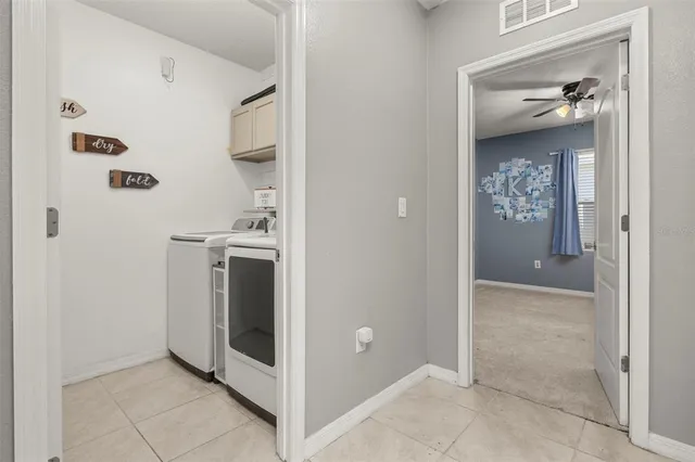 a view of hallway with stairs and furniture