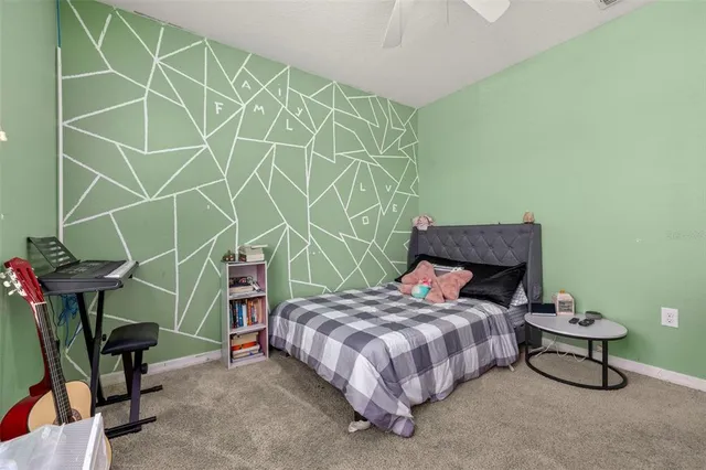 a bedroom with a bed and a cabinets