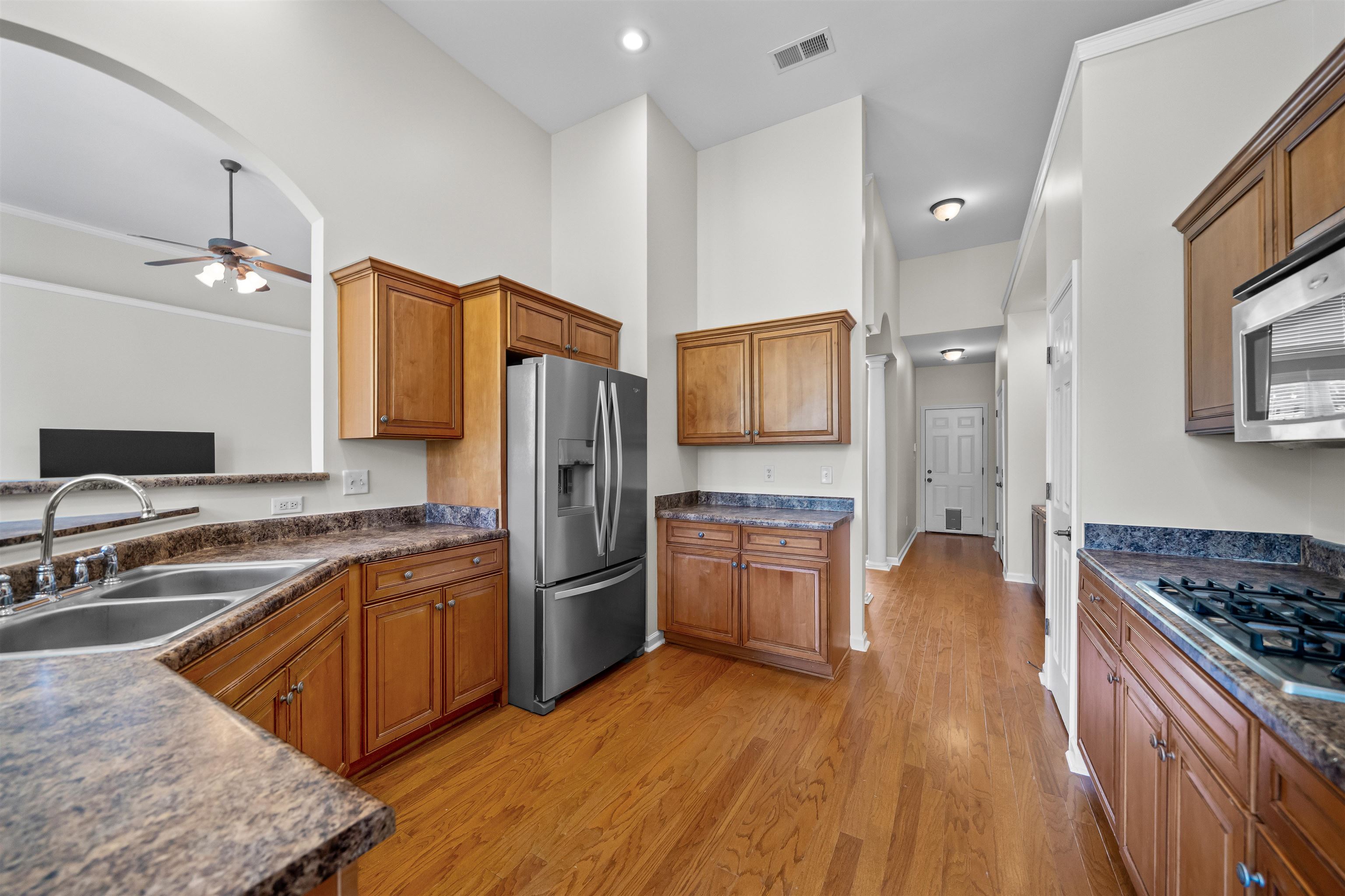 5035 Brian Ridge Road Arlington, TN 38002 - Photo 6 of 40 Kitchen featuring wood-finish flooring, recessed lighting, and a stainless steel refrigerator
