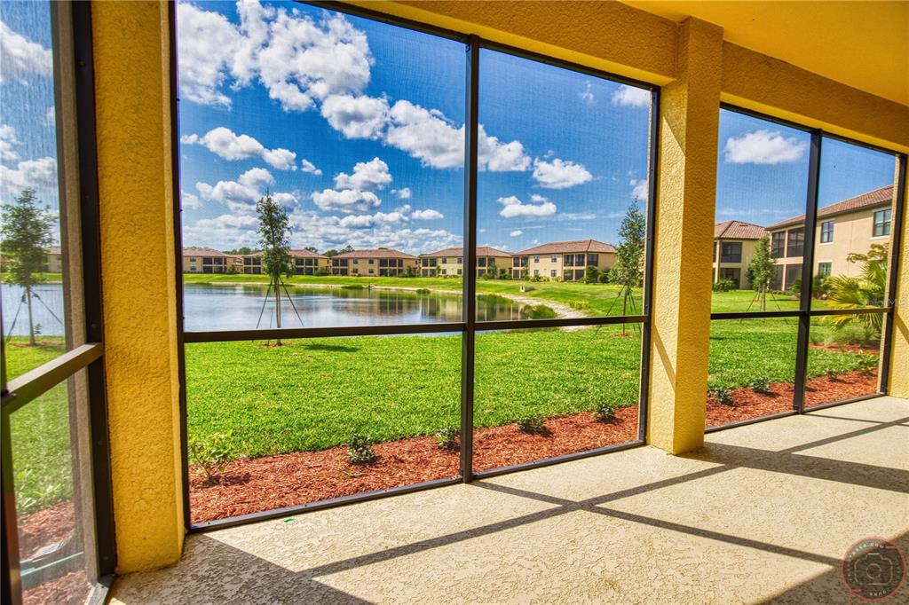 12355 Ghiberti Circle, Unit 101 Venice, FL 34293 - Photo 16 of 41 a view of a porch and a yard