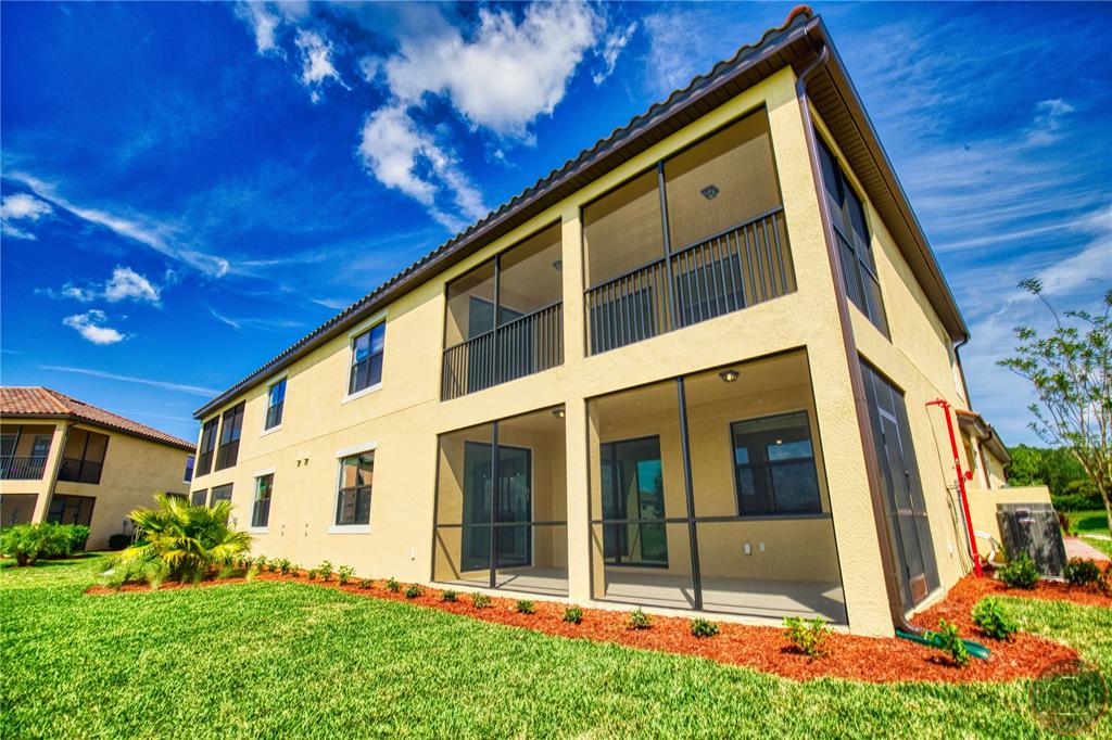12355 Ghiberti Circle, Unit 101 Venice, FL 34293 - Photo 20 of 41 a view of house with yard