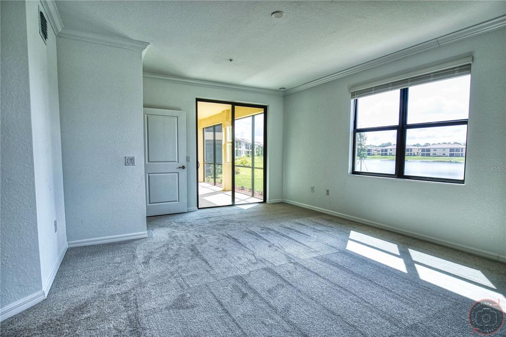 12355 Ghiberti Circle, Unit 101 Venice, FL 34293 - Photo 23 of 41 a view of an empty room with a window