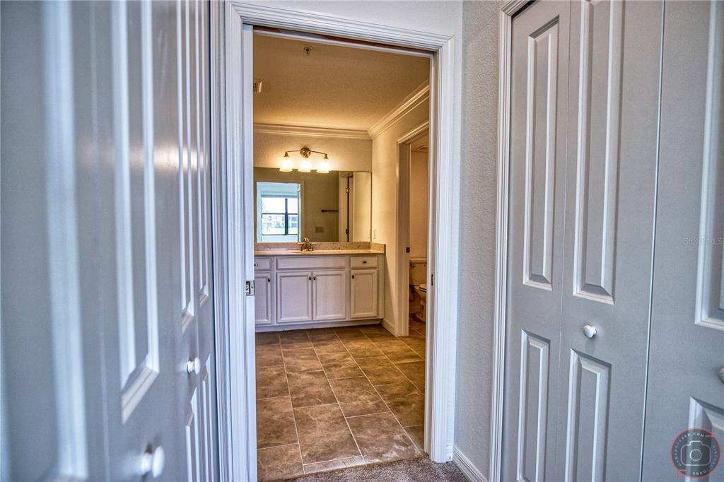 12355 Ghiberti Circle, Unit 101 Venice, FL 34293 - Photo 25 of 41 a bathroom with a sink and a mirror