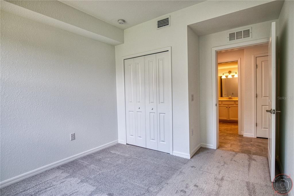 12355 Ghiberti Circle, Unit 101 Venice, FL 34293 - Photo 29 of 41 a view of an empty room with closet and a window