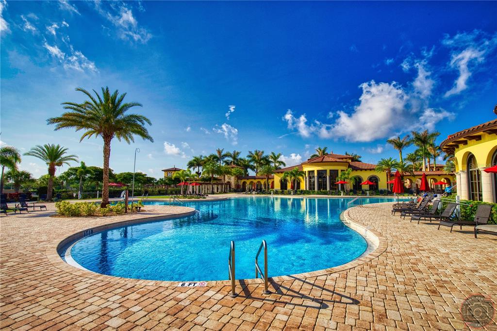 12355 Ghiberti Circle, Unit 101 Venice, FL 34293 - Photo 3 of 41 a view of a swimming pool with a house