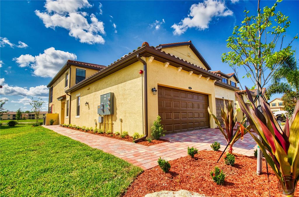 12355 Ghiberti Circle, Unit 101 Venice, FL 34293 - Photo 35 of 41 a front view of a house with a yard