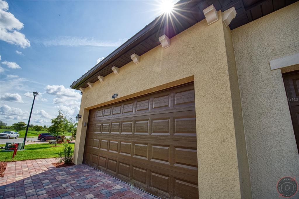 12355 Ghiberti Circle, Unit 101 Venice, FL 34293 - Photo 38 of 41 a front view of a house with a yard