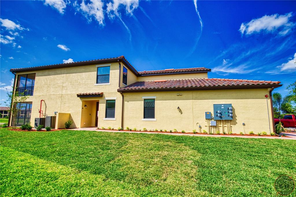 12355 Ghiberti Circle, Unit 101 Venice, FL 34293 - Photo 40 of 41 a front view of a house with garden