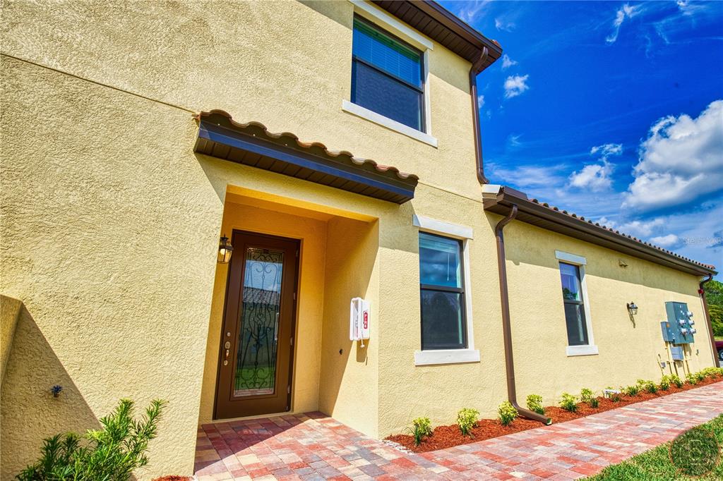 12355 Ghiberti Circle, Unit 101 Venice, FL 34293 - Photo 41 of 41 a front view of a house with a yard