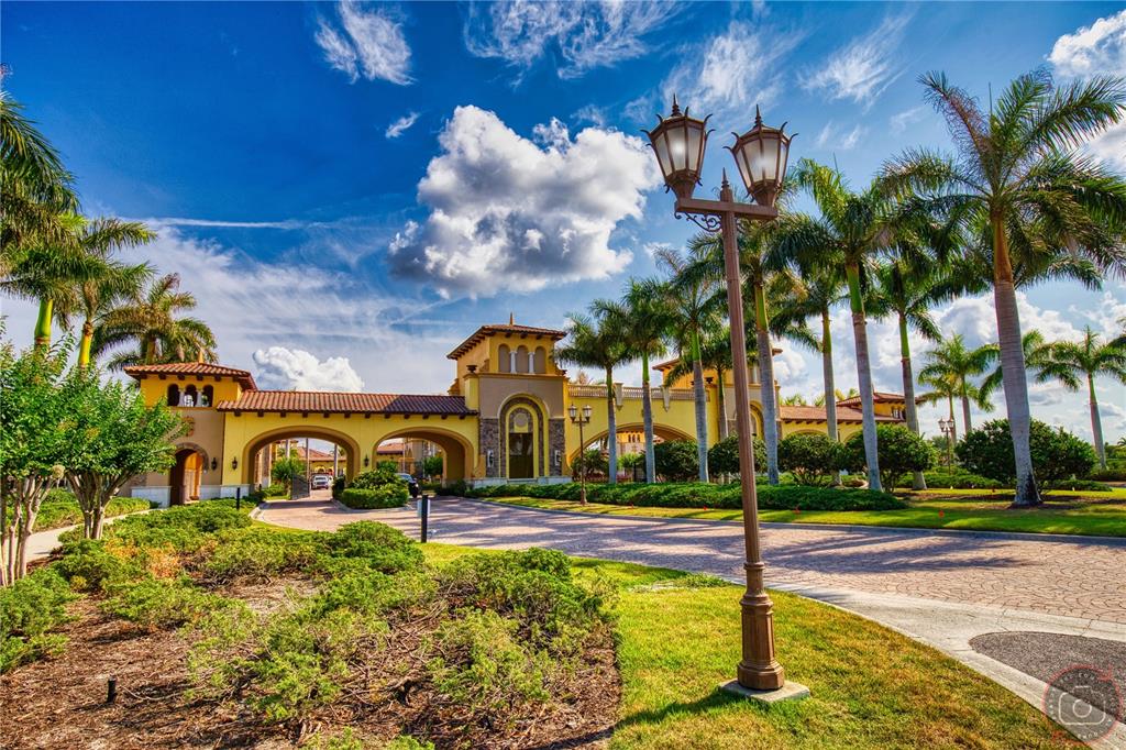 12355 Ghiberti Circle, Unit 101 Venice, FL 34293 - Photo 5 of 41 a front view of a house with swimming pool