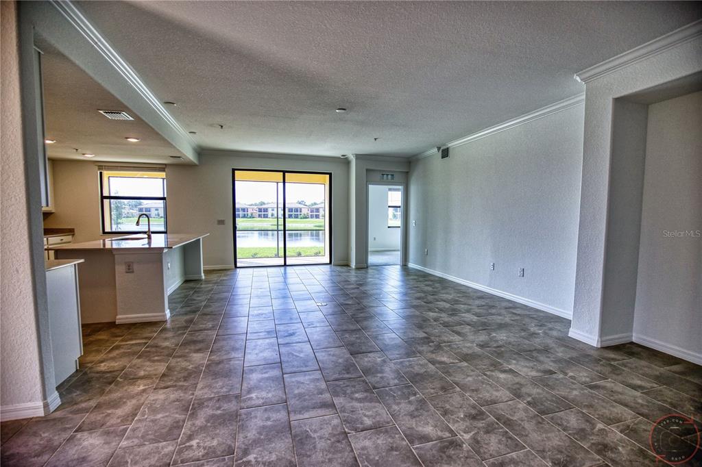 12355 Ghiberti Circle, Unit 101 Venice, FL 34293 - Photo 7 of 41 a view of a hallway with furniture and a window
