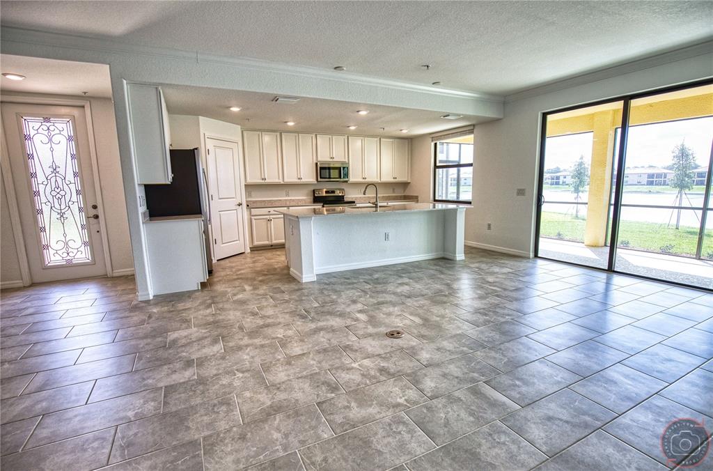 12355 Ghiberti Circle, Unit 101 Venice, FL 34293 - Photo 10 of 41 a view of large kitchen with stainless steel appliances cabinets