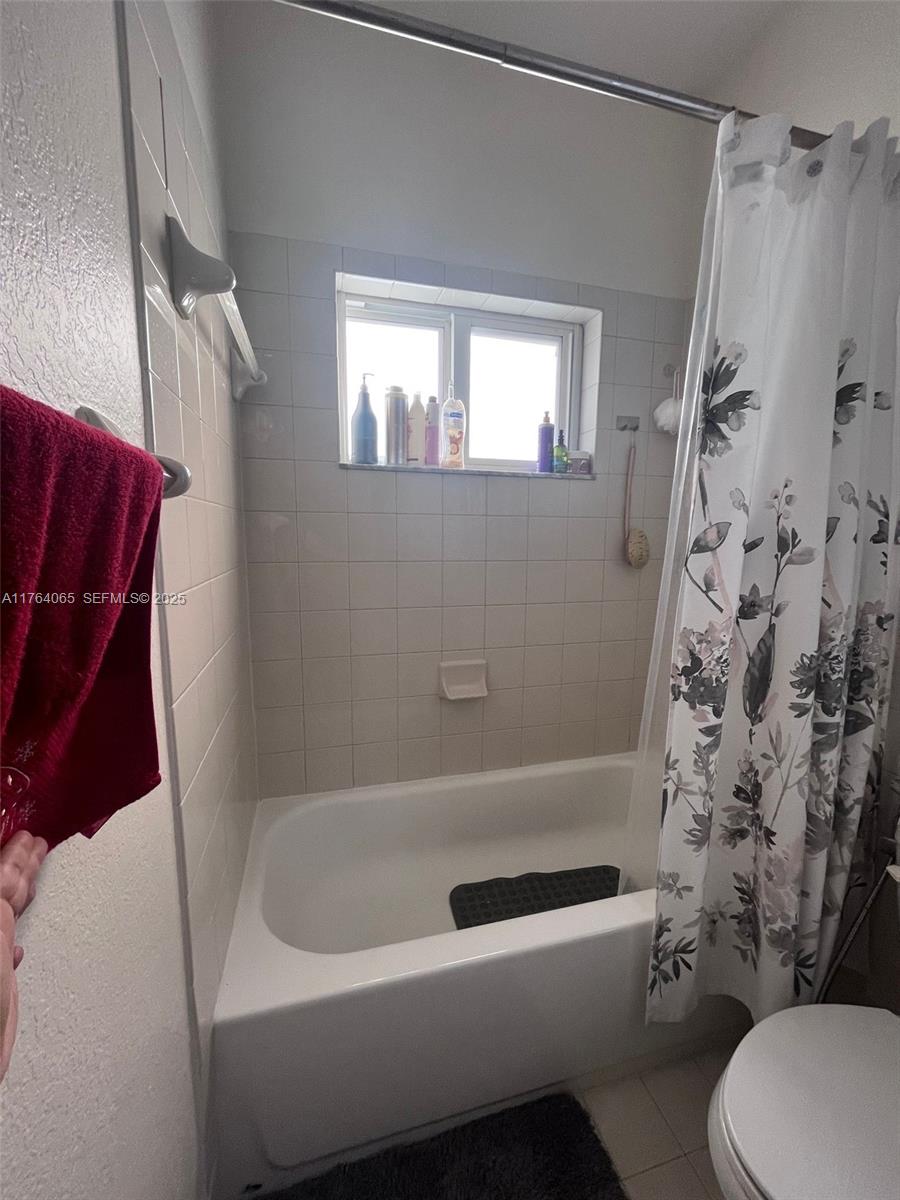 22937 Southwest 9th Avenue, Unit 1 Miami, FL 33170 - Photo 18 of 19 a bathroom with a toilet and a shower