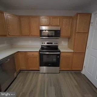 a kitchen with a sink and a stove top oven