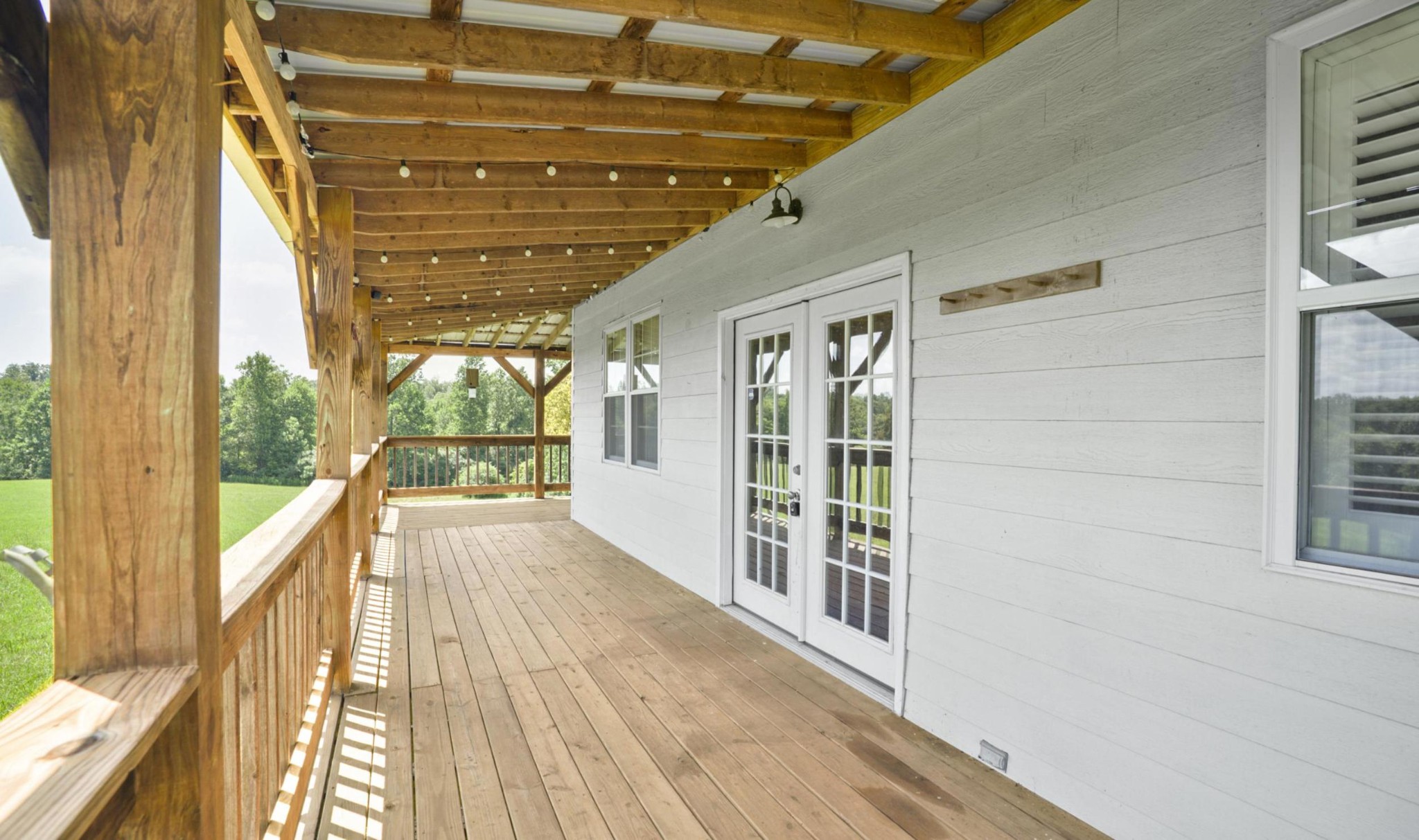 1005 Birdwell Road Red Boiling Springs, TN 37150 - Photo 12 of 59 a view of a balcony with wooden floor