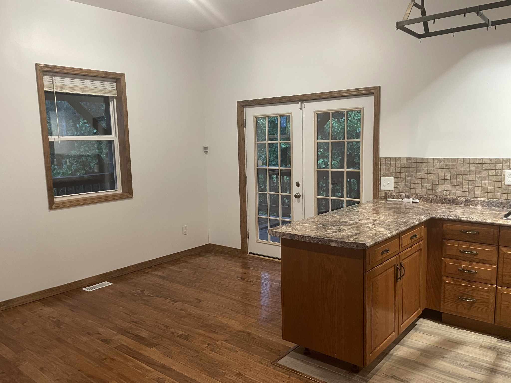 1005 Birdwell Road Red Boiling Springs, TN 37150 - Photo 16 of 59 an empty room with wooden floor and cabinet