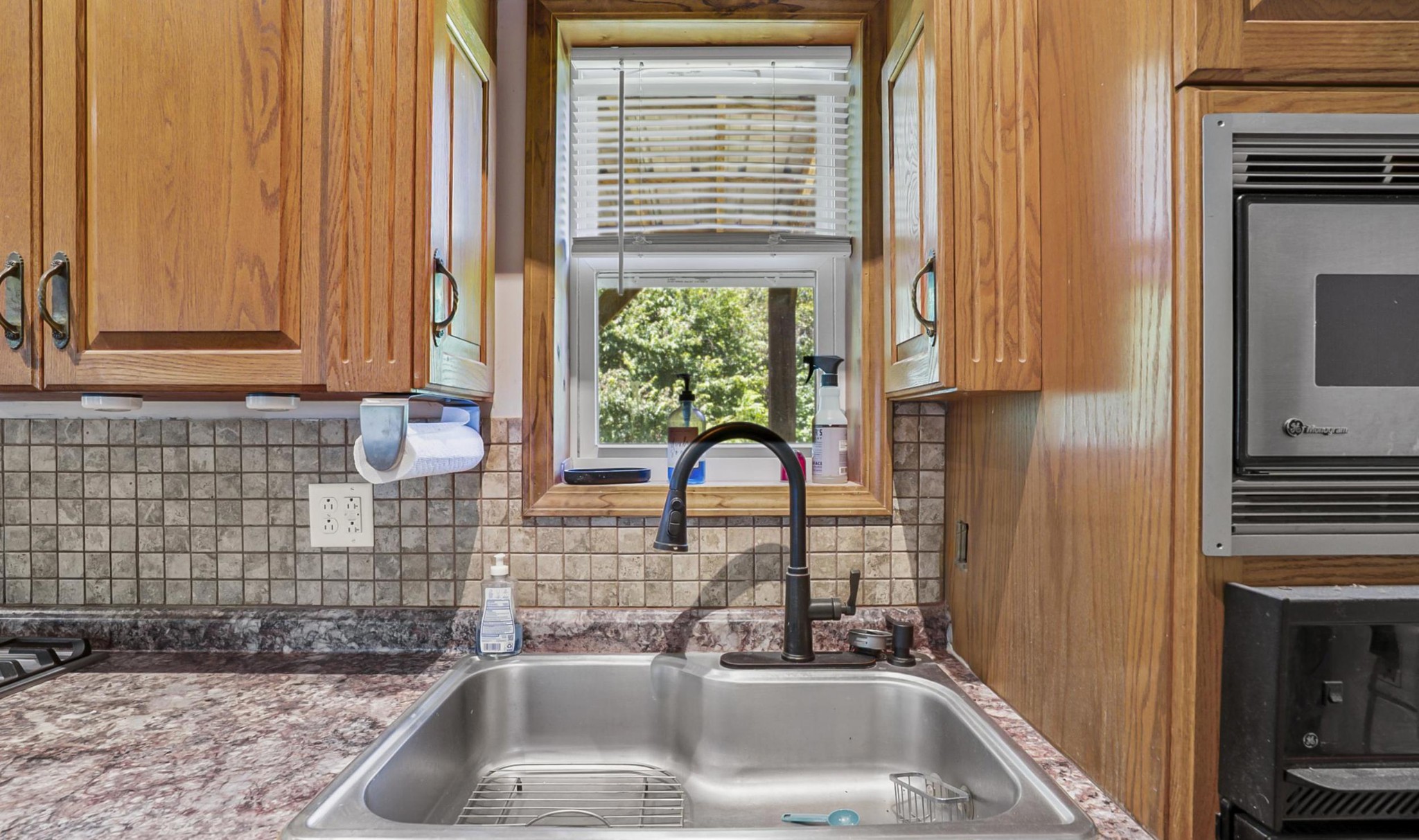 1005 Birdwell Road Red Boiling Springs, TN 37150 - Photo 18 of 59 a bathroom with a sink a vanity and a window