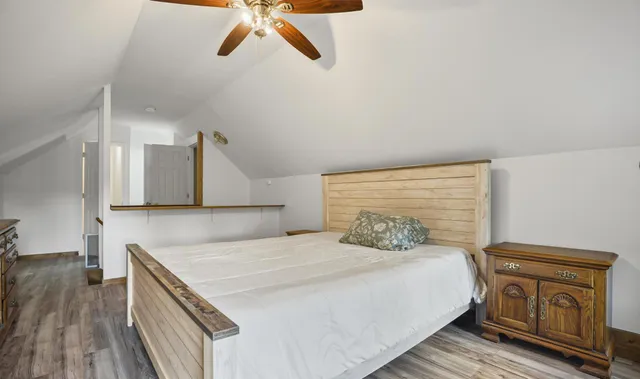 a view of a field with an trees in the background