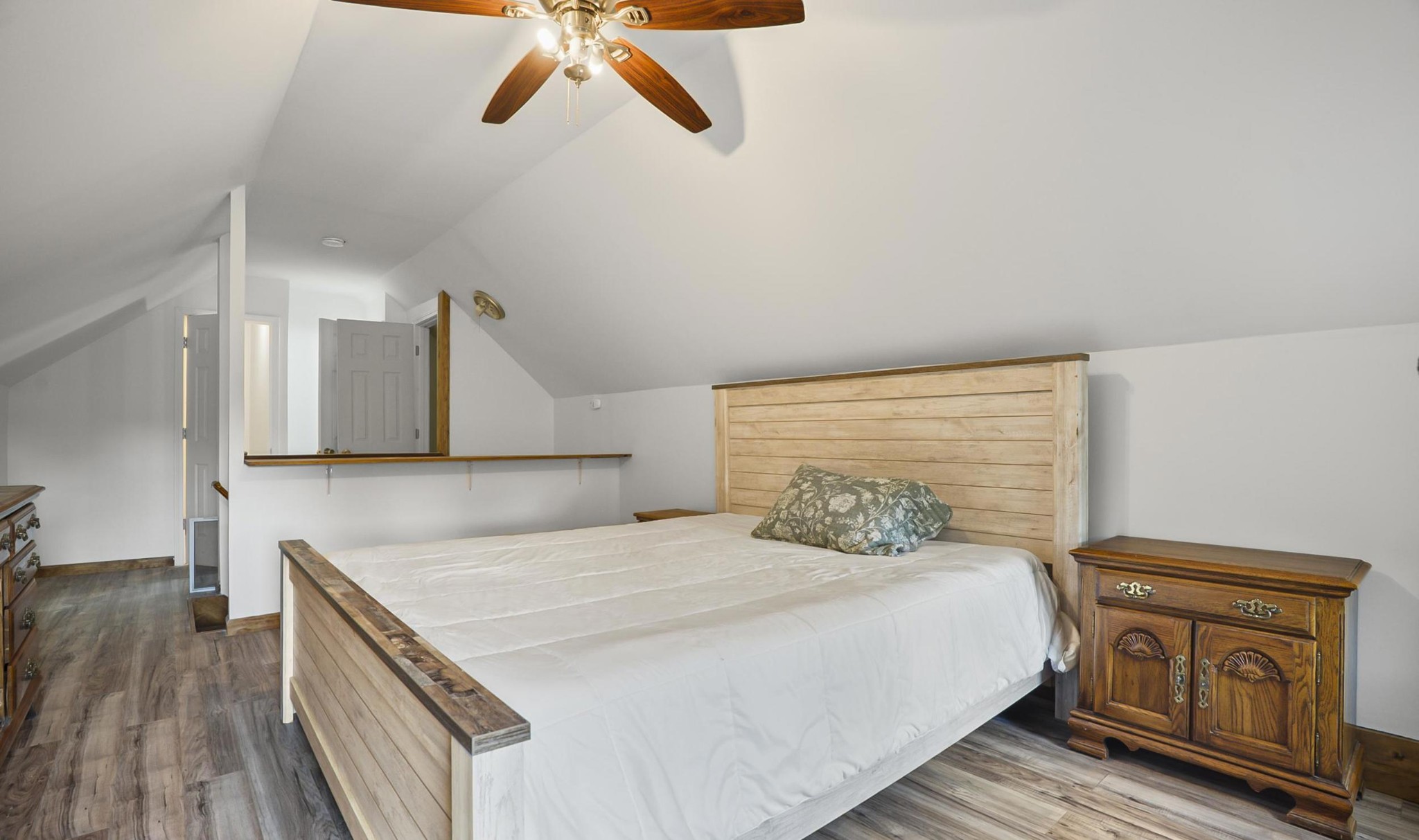 1005 Birdwell Road Red Boiling Springs, TN 37150 - Photo 20 of 59 a bedroom with a bed and wooden floor