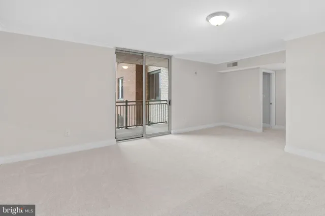 a bedroom with a large bed and a flat screen tv