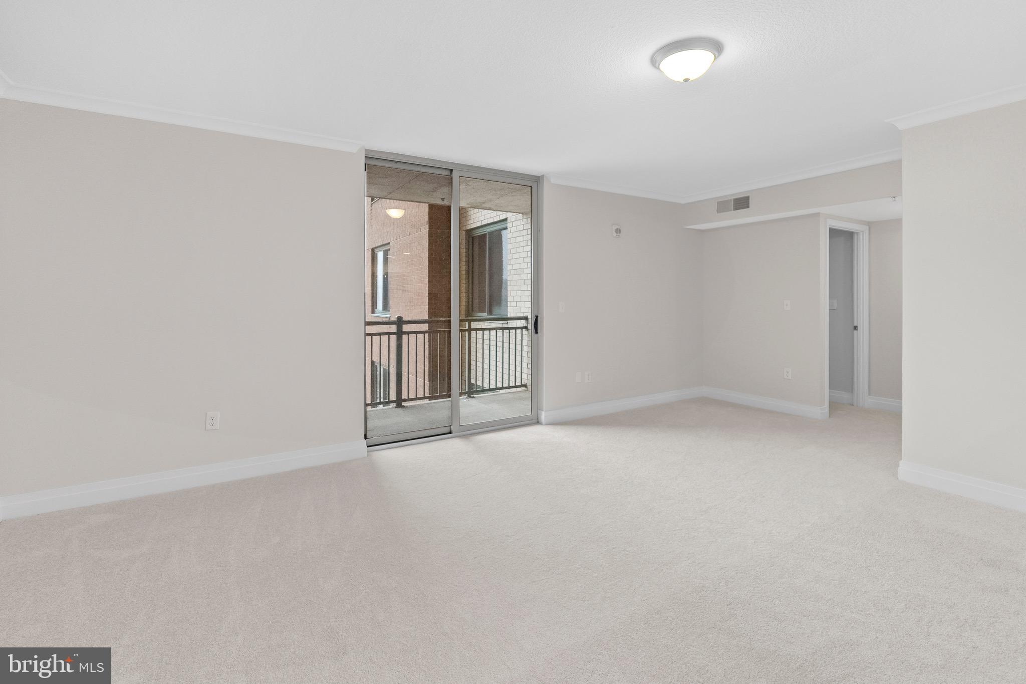 414 Water Street, Unit 1501 Baltimore, MD 21202 - Photo 12 of 21 an empty room with windows