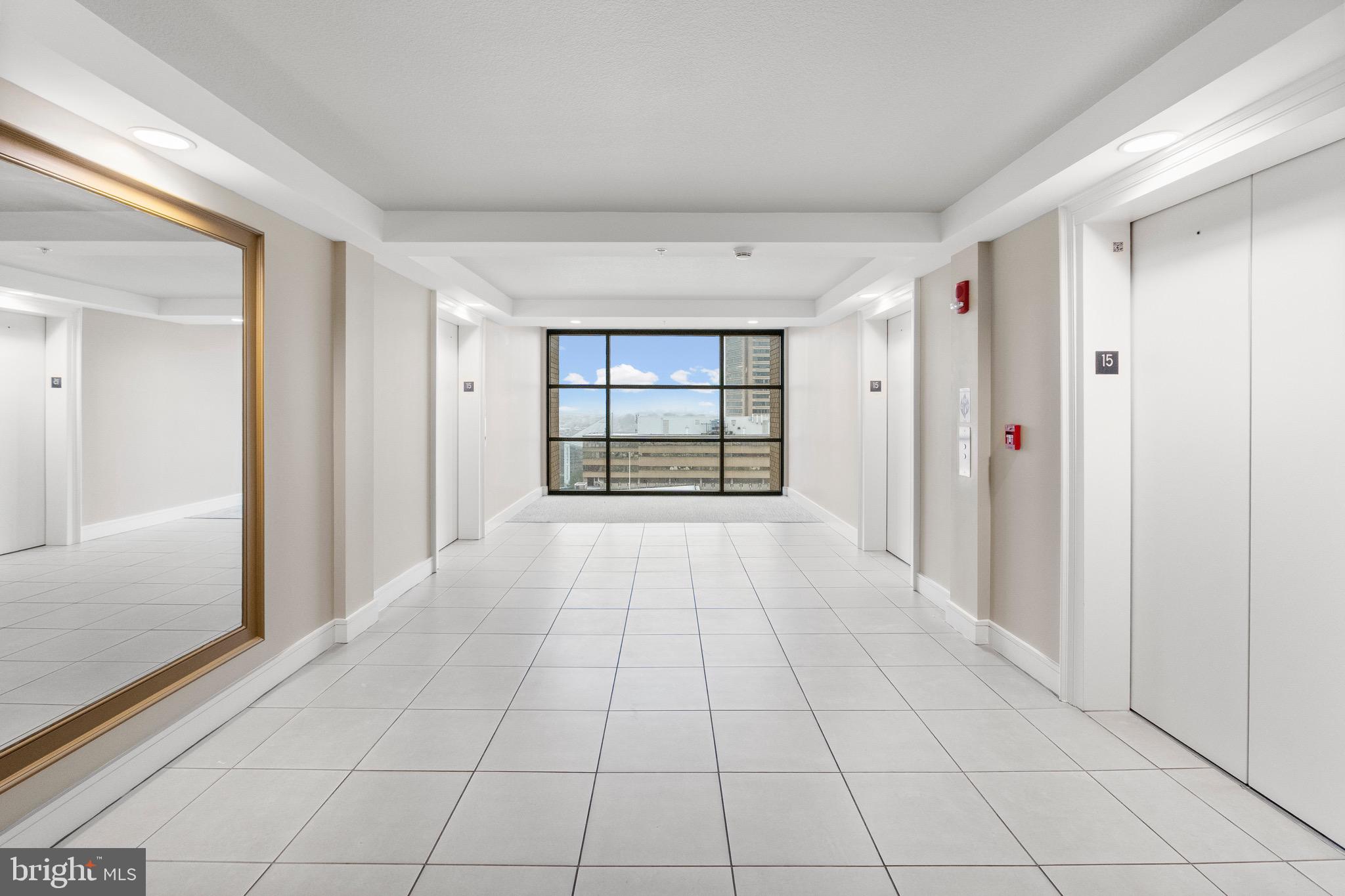 414 Water Street, Unit 1501 Baltimore, MD 21202 - Photo 6 of 21 a view of an empty room and window