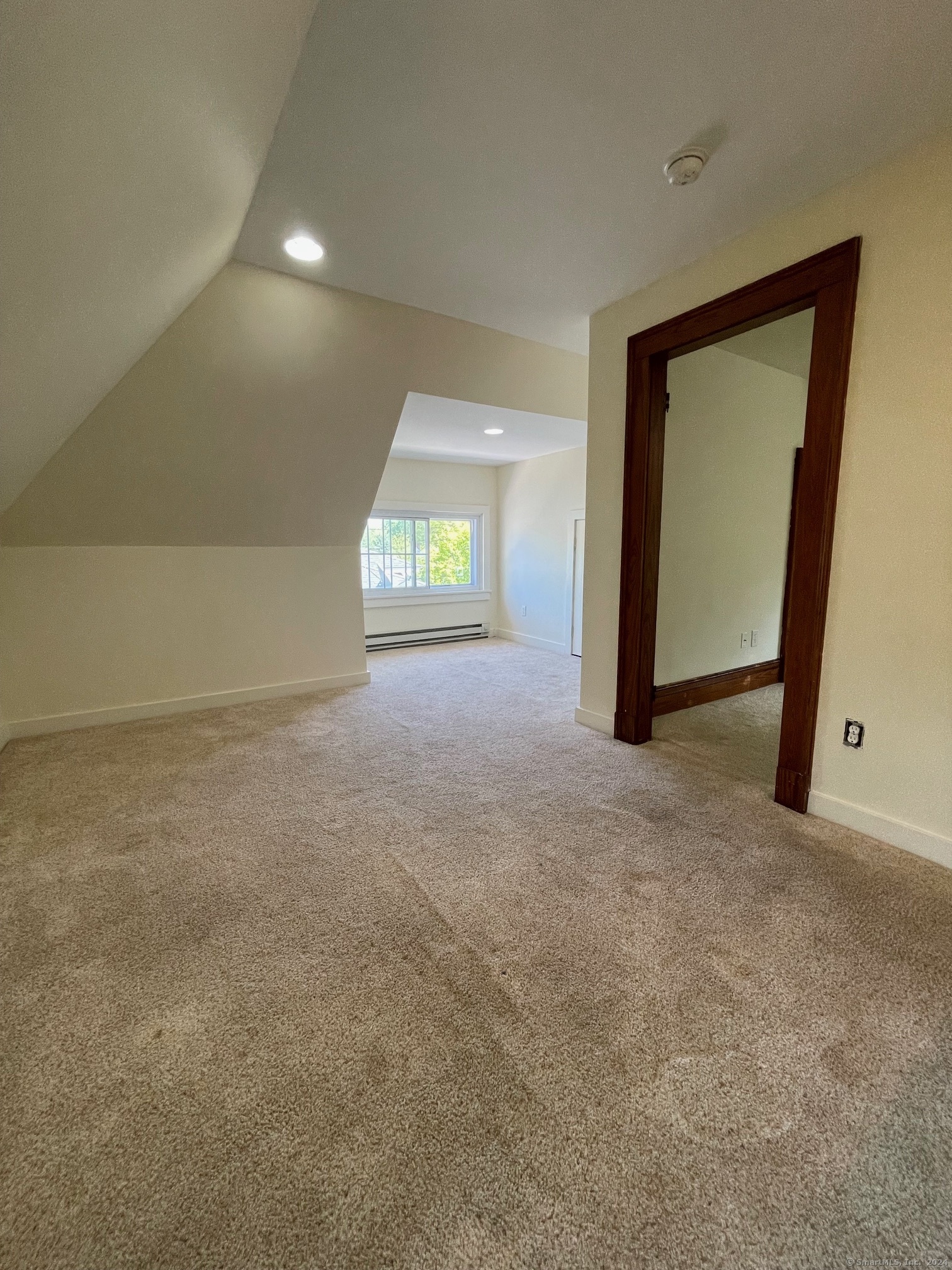 809 Edgewood Avenue, Unit 2 New Haven, CT 06515 - Photo 12 of 15 a view of an empty room with a window