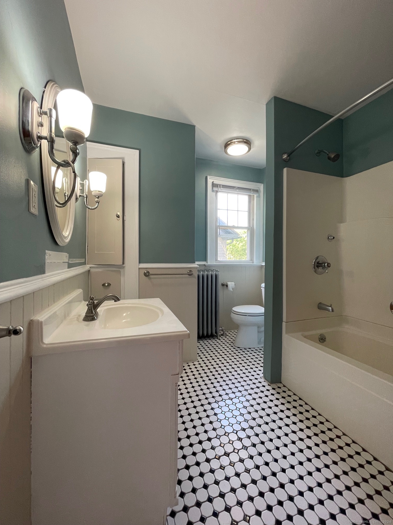809 Edgewood Avenue, Unit 2 New Haven, CT 06515 - Photo 8 of 15 a en suite bathroom with a sink double vanity mirror and bathtub