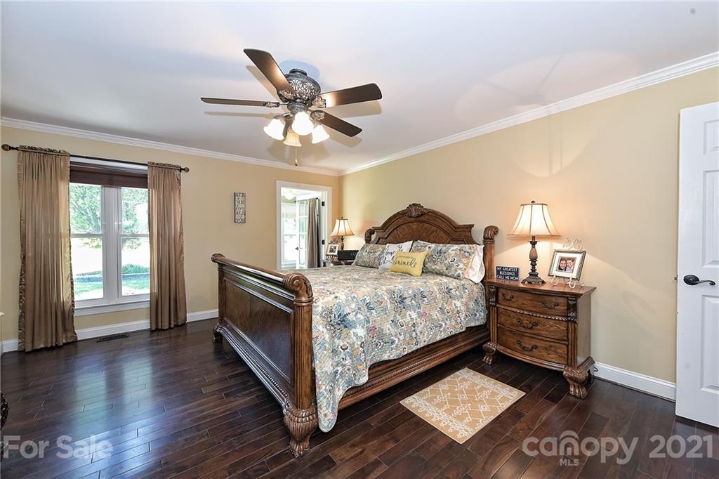 1715 Rock Rest Road, Unit PARCEL 3 Wingate, NC 28174 - Photo 14 of 48 a bedroom with a bed and wooden floor
