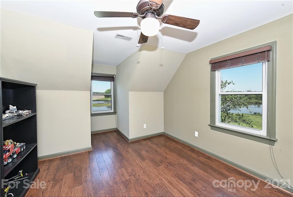 1715 Rock Rest Road, Unit PARCEL 3 Wingate, NC 28174 - Photo 22 of 48 a view of an empty room with window and wooden floor