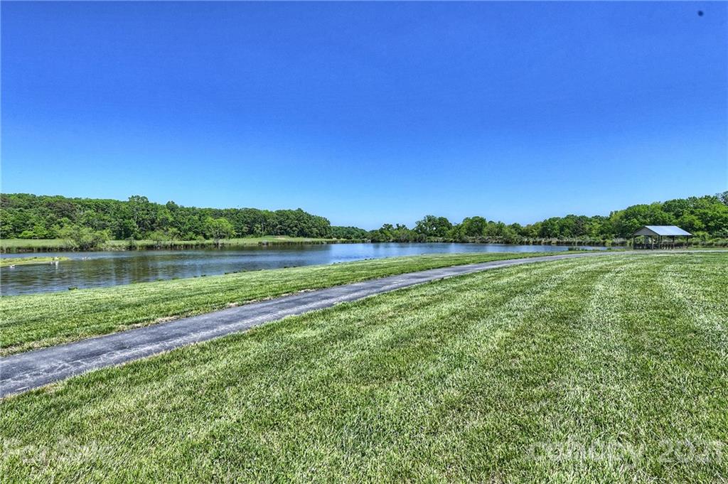 1715 Rock Rest Road, Unit PARCEL 3 Wingate, NC 28174 - Photo 40 of 48 a view of a lake with houses in the back