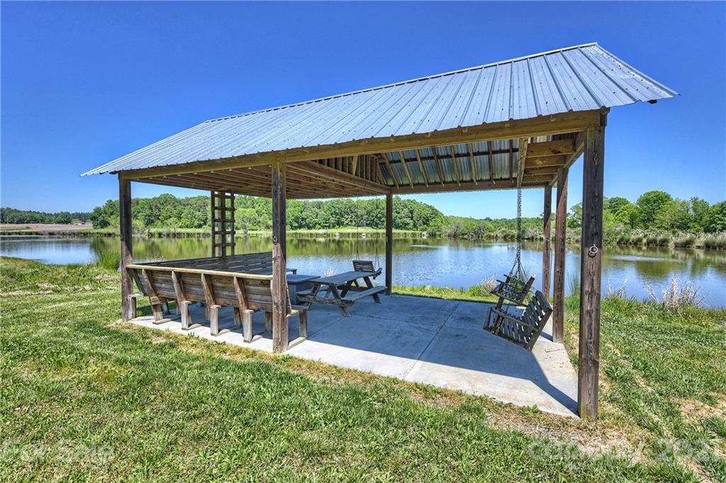 1715 Rock Rest Road, Unit PARCEL 3 Wingate, NC 28174 - Photo 8 of 48 an outdoor sitting area with swimming pool in the backyard