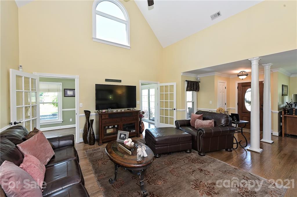 1715 Rock Rest Road, Unit PARCEL 3 Wingate, NC 28174 - Photo 9 of 48 a living room with furniture a flat screen tv and a large window