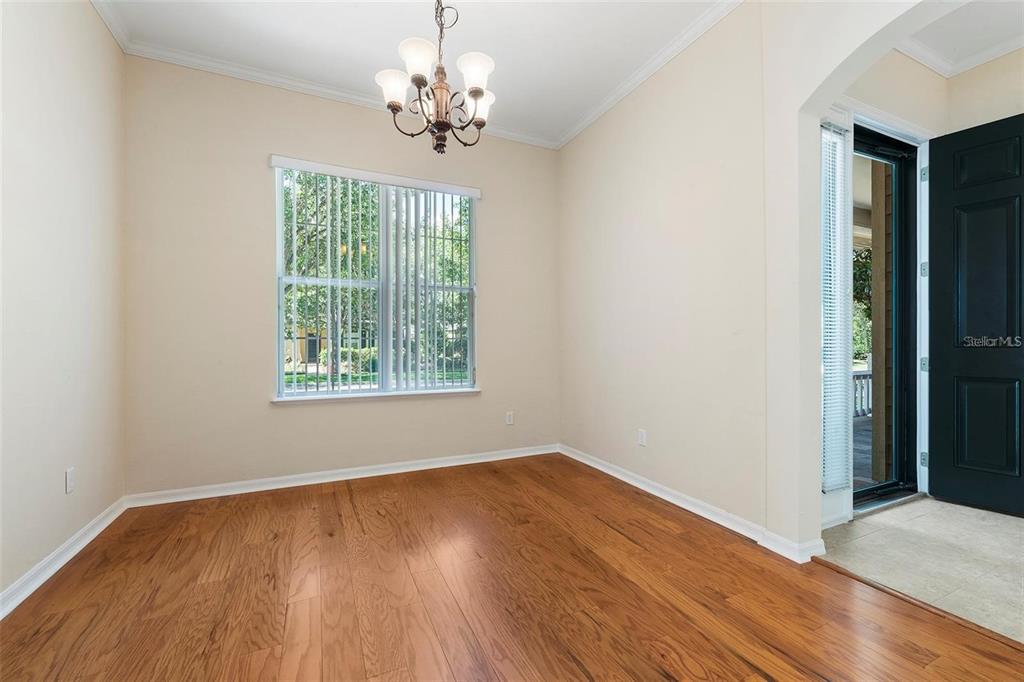 8668 Southwest 77th Avenue Gainesville, FL 32608 - Photo 14 of 29 a view of empty room with wooden floor and fan