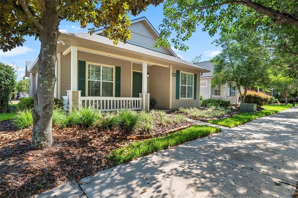 8668 Southwest 77th Avenue Gainesville, FL 32608 - Photo 2 of 29 a front view of a house with a garden