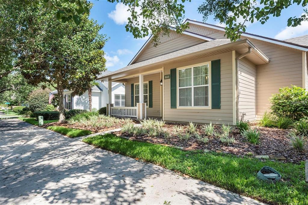 8668 Southwest 77th Avenue Gainesville, FL 32608 - Photo 3 of 29 a front view of a house with garden