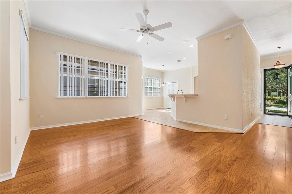 8668 Southwest 77th Avenue Gainesville, FL 32608 - Photo 5 of 29 a view of an empty room with wooden floor and a window