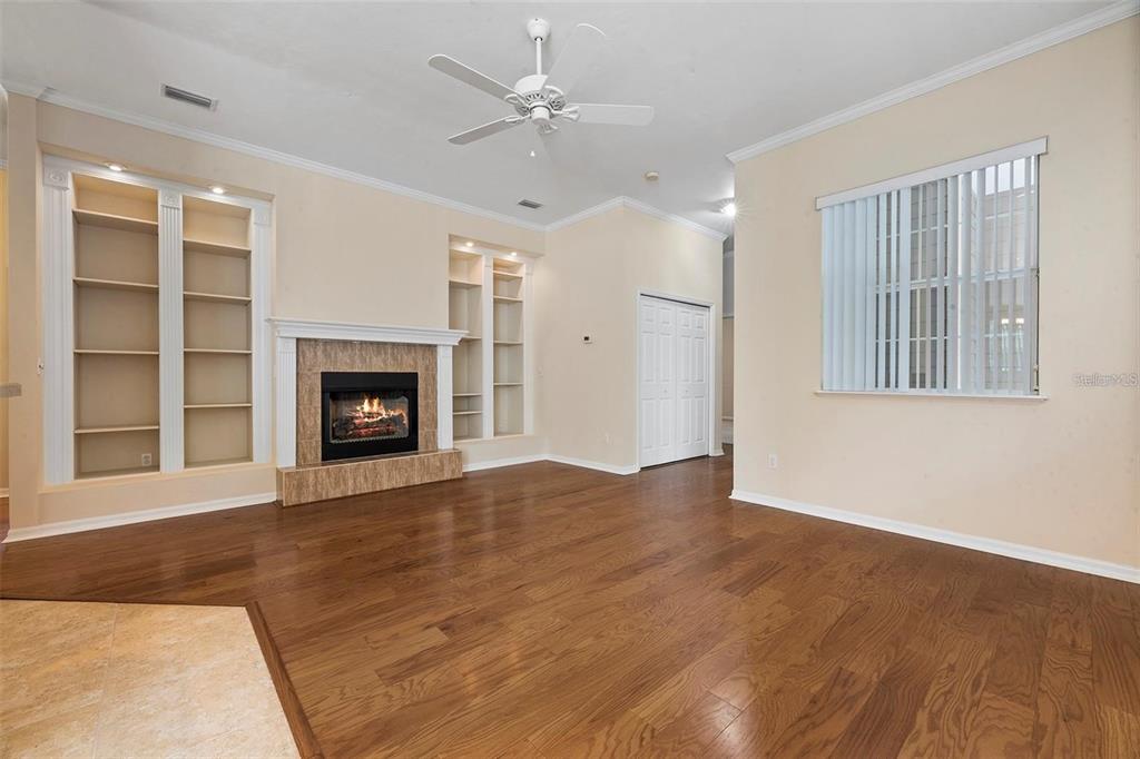 8668 Southwest 77th Avenue Gainesville, FL 32608 - Photo 7 of 29 a view of an empty room with a fireplace and a window