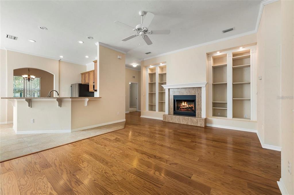 8668 Southwest 77th Avenue Gainesville, FL 32608 - Photo 8 of 29 a view of a living room with granite countertop wooden floor and a fireplace