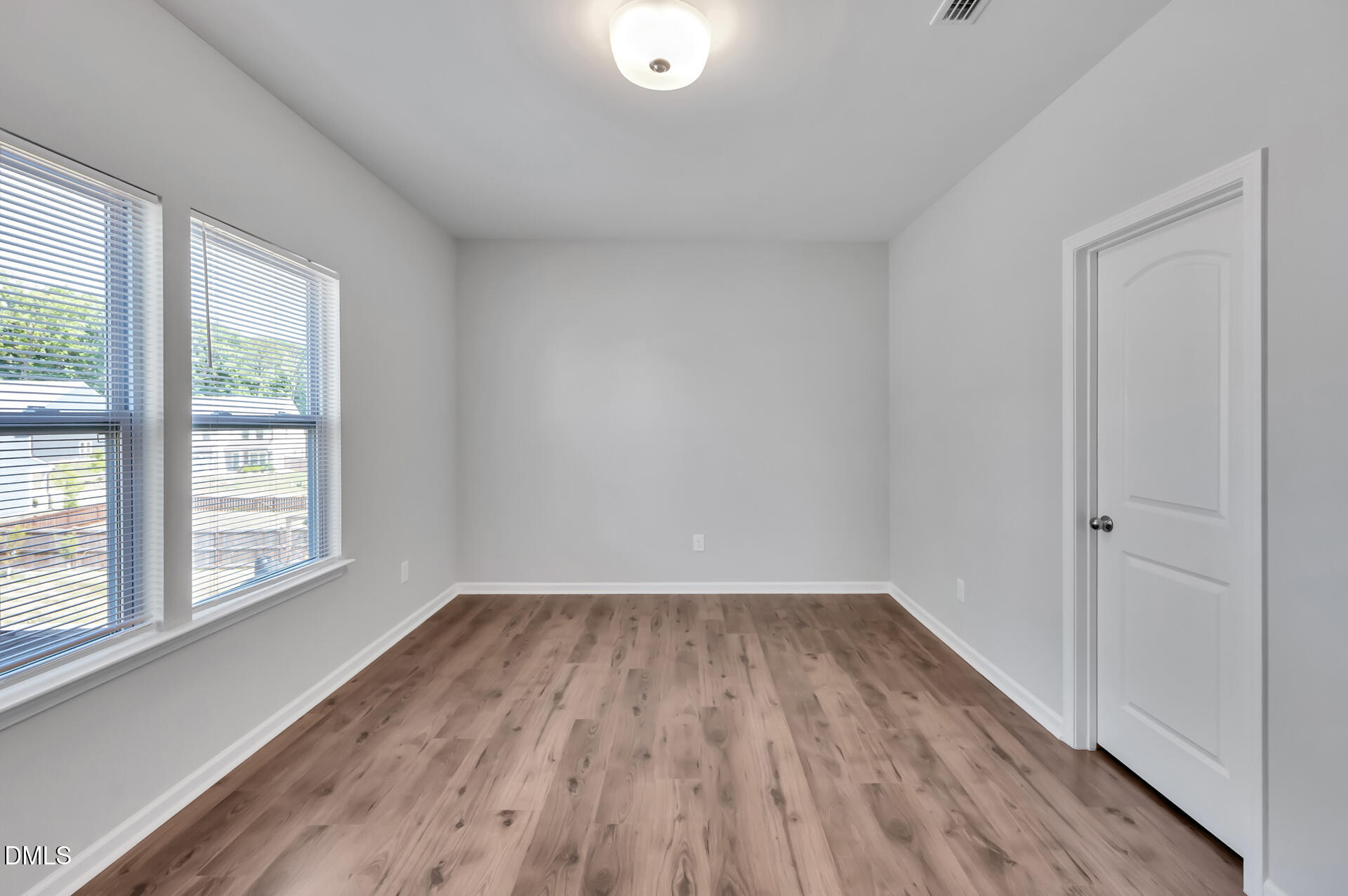 5406 Ripplebrook Drive Durham, NC 27712 - Photo 30 of 37 wooden floor in an empty room with a window