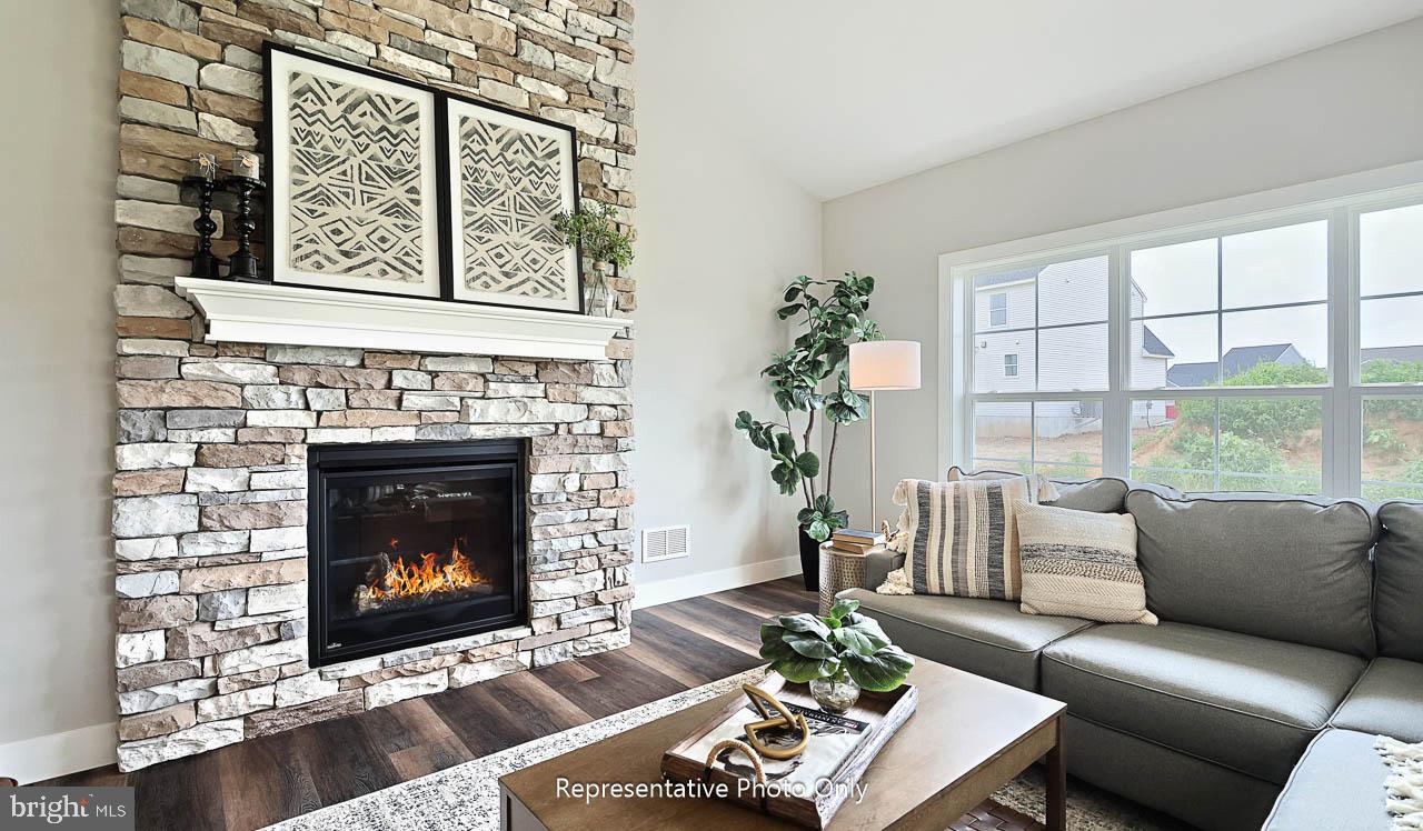 116 Washington Crossing York, PA 17404 - Photo 14 of 32 a living room with furniture a fireplace and a large window