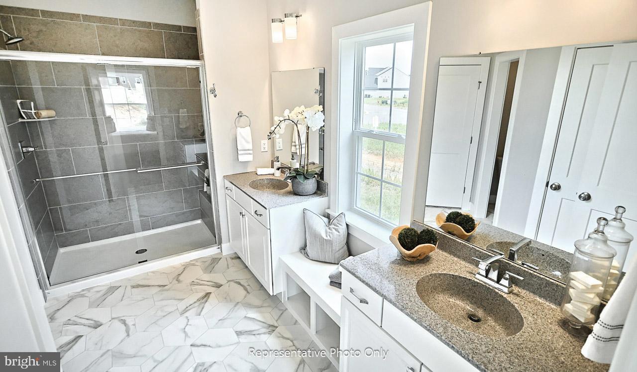 116 Washington Crossing York, PA 17404 - Photo 18 of 32 a bathroom with a granite countertop sink and a mirror