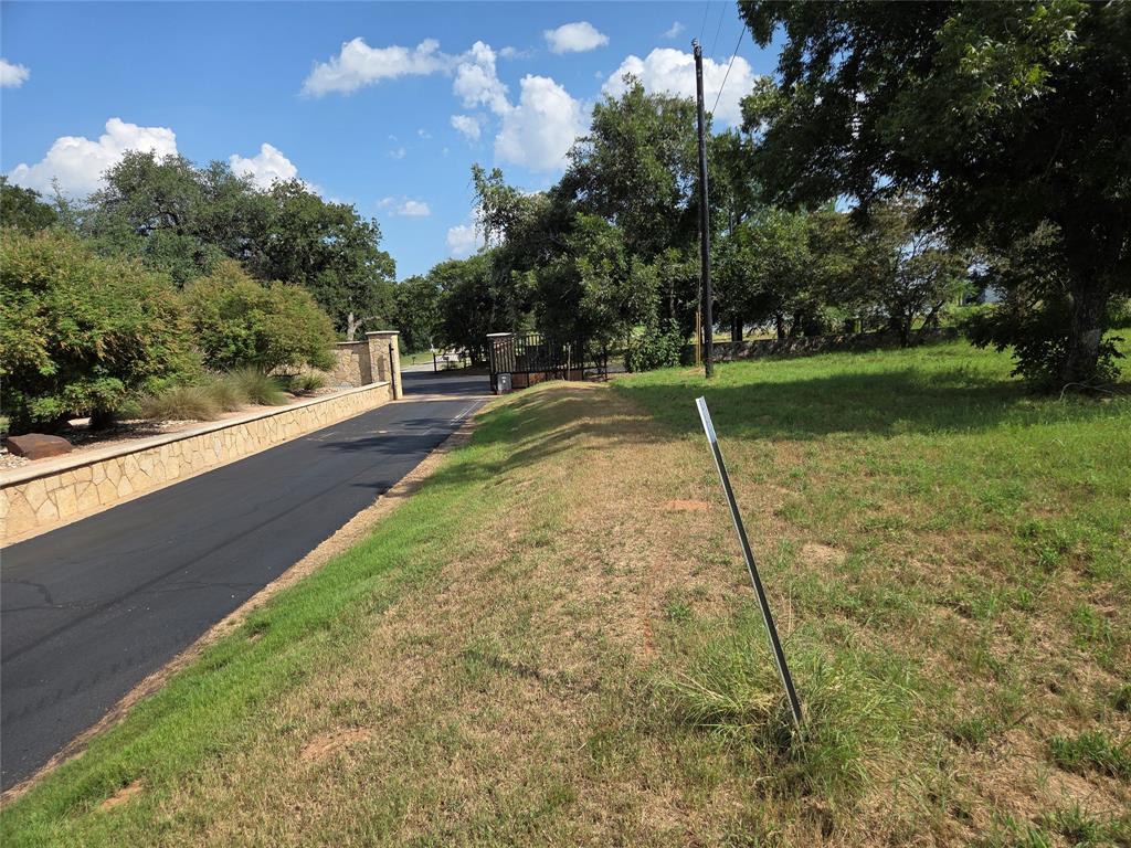 10005 Orchards Boulevard Cleburne, TX 76033 - Photo 11 of 25 a backyard of a house with lots of green space