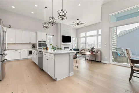 a white stove top oven sitting inside of a kitchen