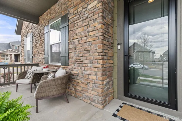 a balcony view with a couch and table