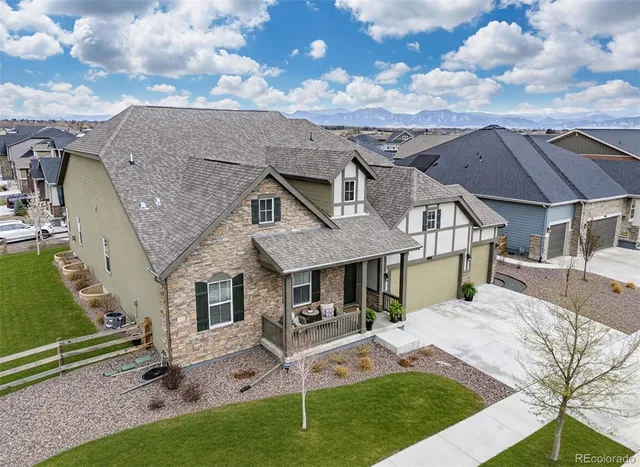 a view of a house with backyard porch and sitting area