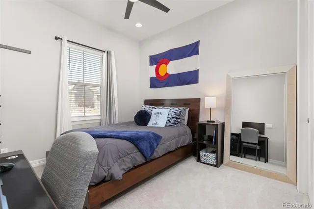 a bathroom with a double vanity sink toilet and shower