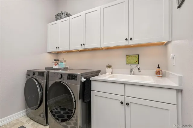 a view of a hallway to a livingroom and a dining room with furniture